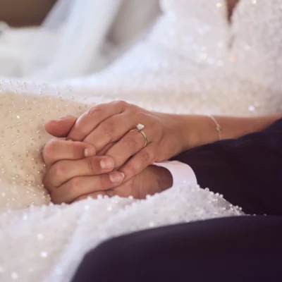 Bride and groom holding hands