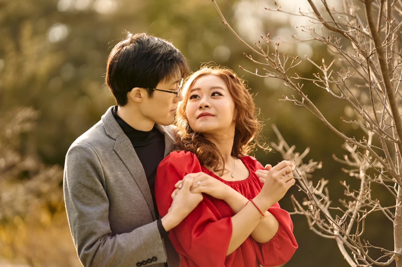 Girl looking at guy while he holds her Kariya Park Engagement Photoshoot
