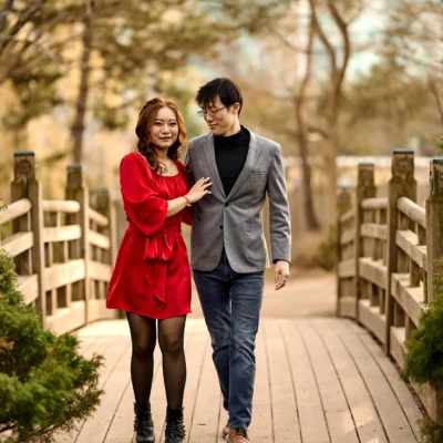 Guy and girl crossing a bridge Kariya Park Engagement Photoshoot