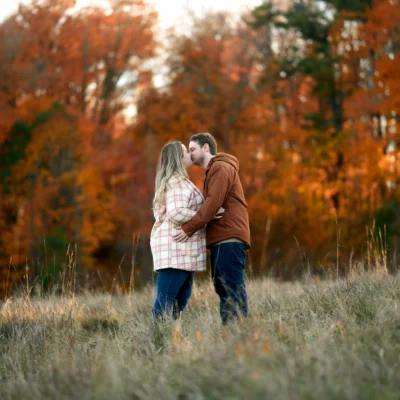 Guy and girl kissing in fall Scotsdale Farm Engagement Photoshoot