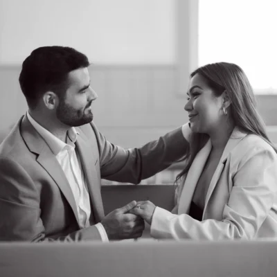 Man and woman in church Black Creek Village Engagement Photoshoot