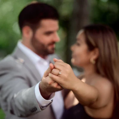 Man and woman showing engagement ring Black Creek Village Engagement Photoshoot