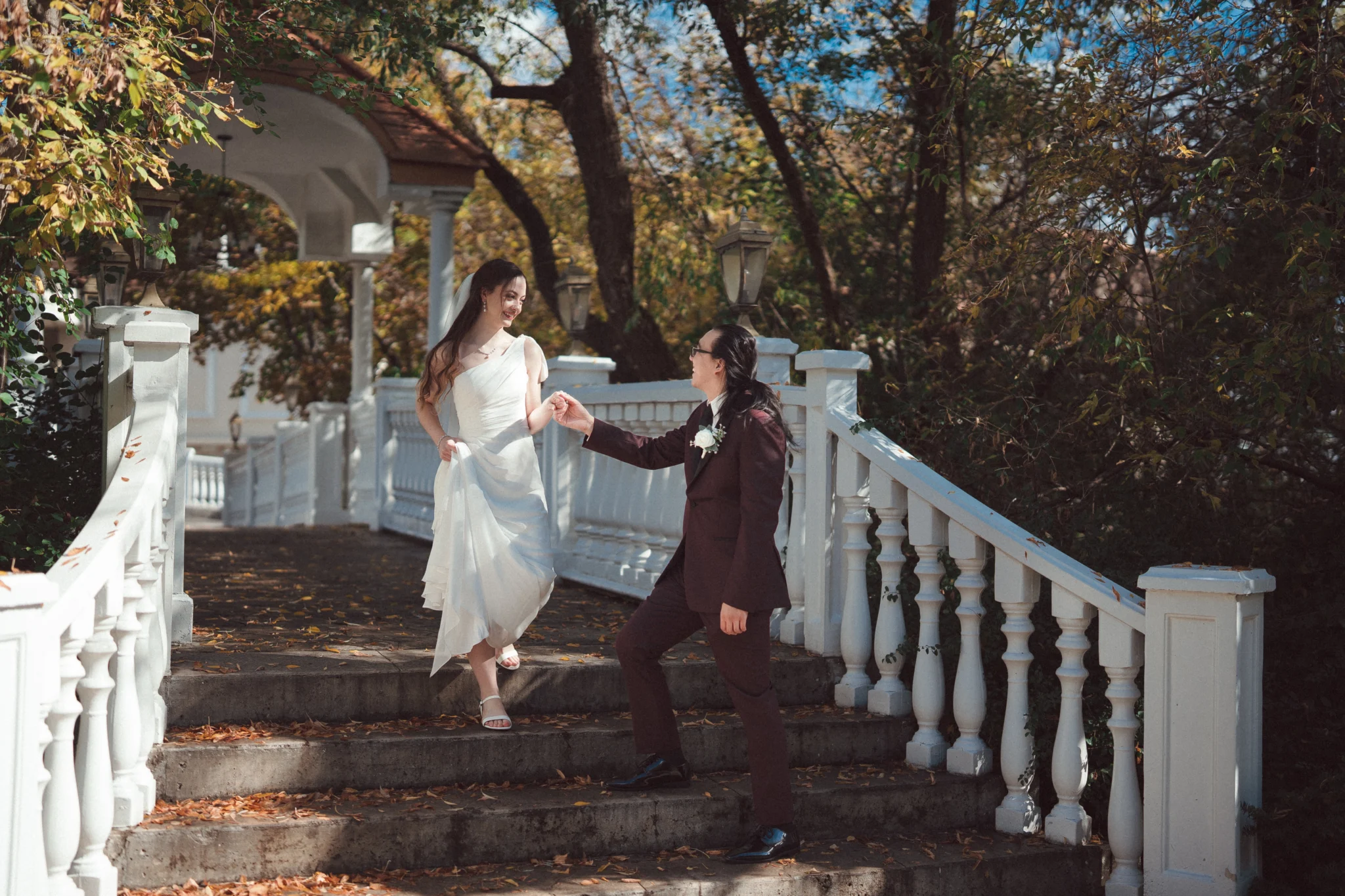 Wedding Couple Walking Down The Stairs