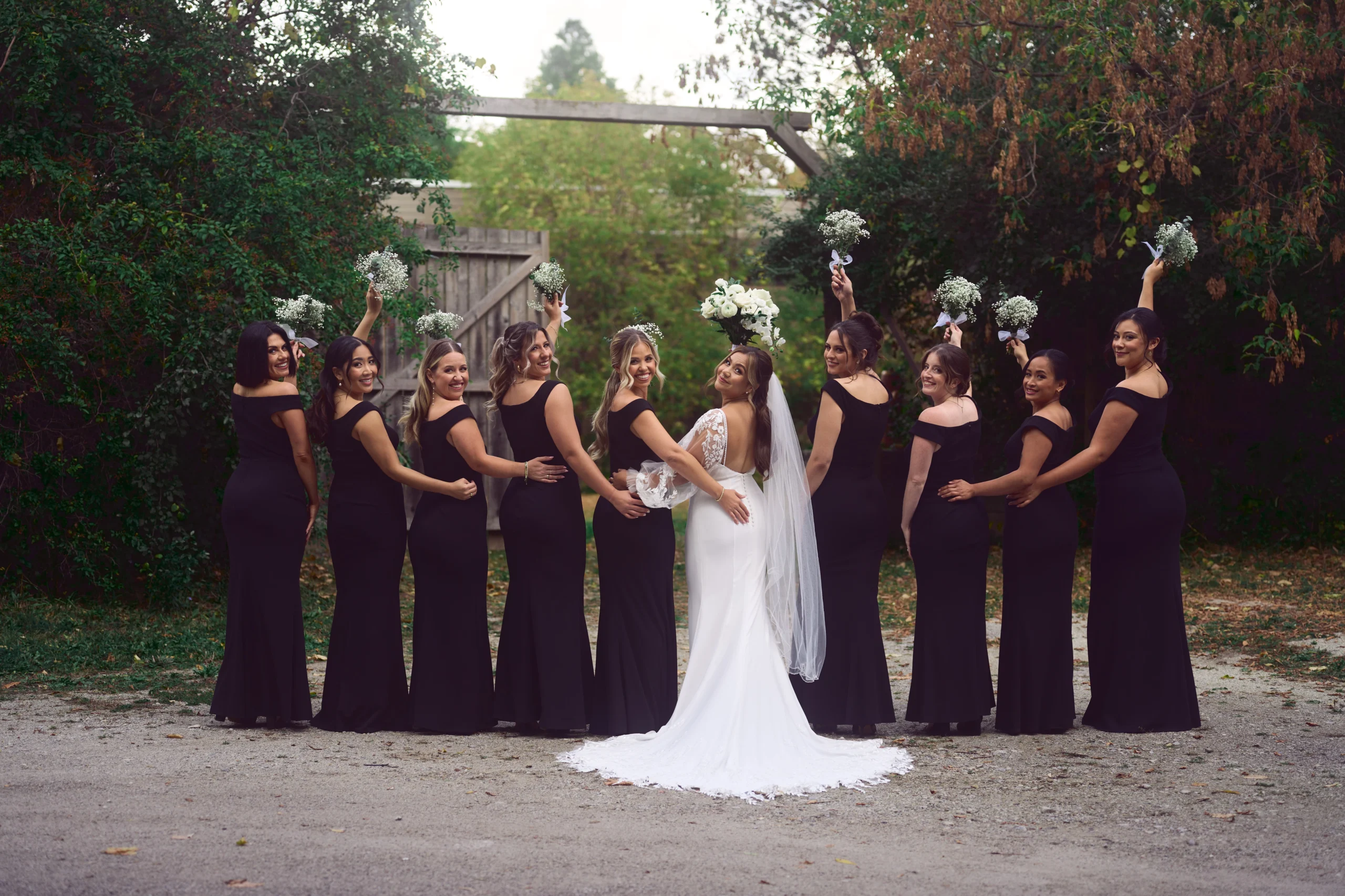 Outdoor wedding portrait of bride with her friends