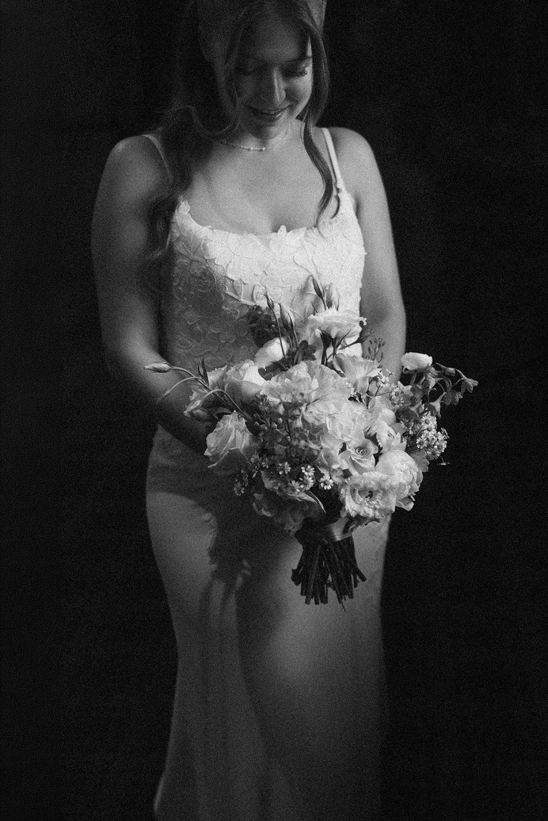 bride looking at her flowers