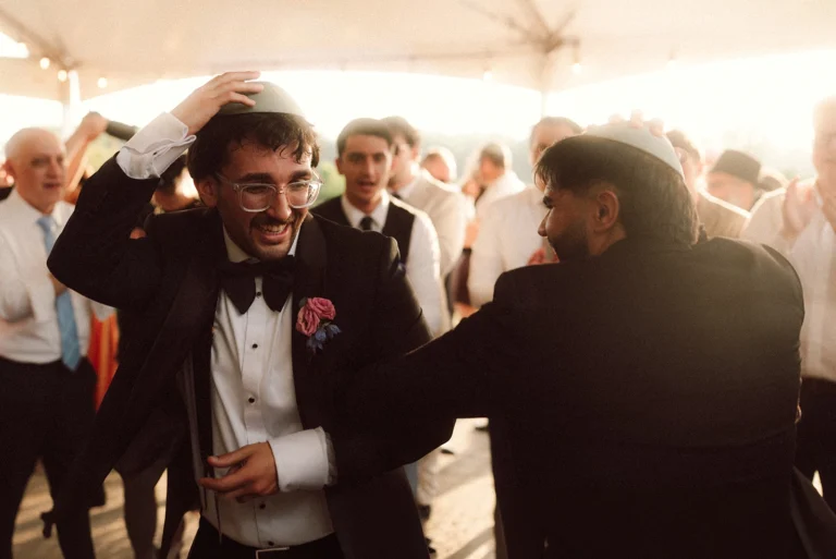 jewish groom dancing after ceremony