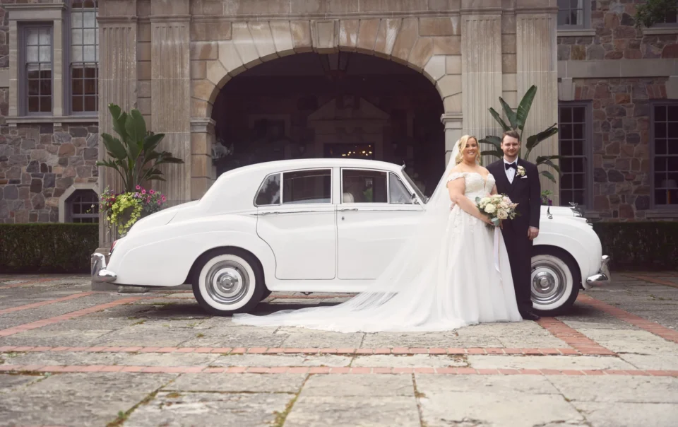 Bride-and-groom-next-to-vintage-car-1-scaled