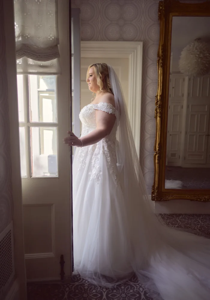 Bride looking out the window