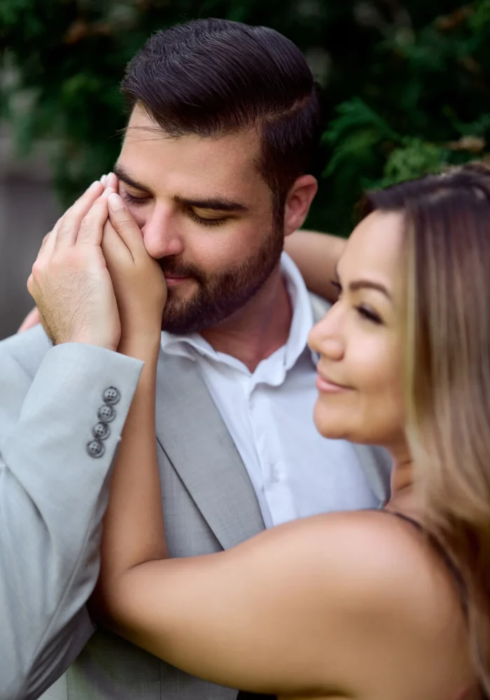 Man kissing woman's hand Black Creek Village Engagement Photoshoot